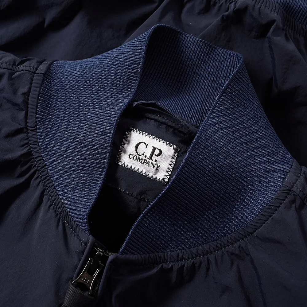 C.P. Company Nycra Stretch Arm Lens Bomber JacketNavy