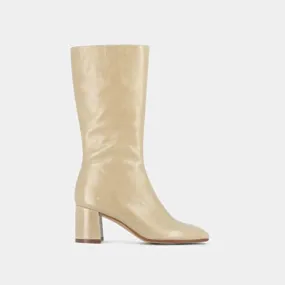 Heeled boots with pointed toe in shiny beige leather